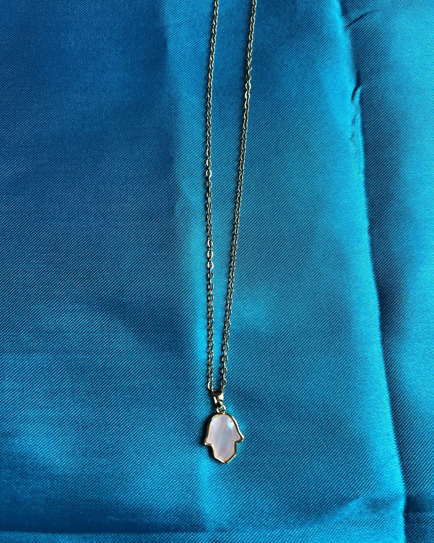 Pearl hamsa hand necklace