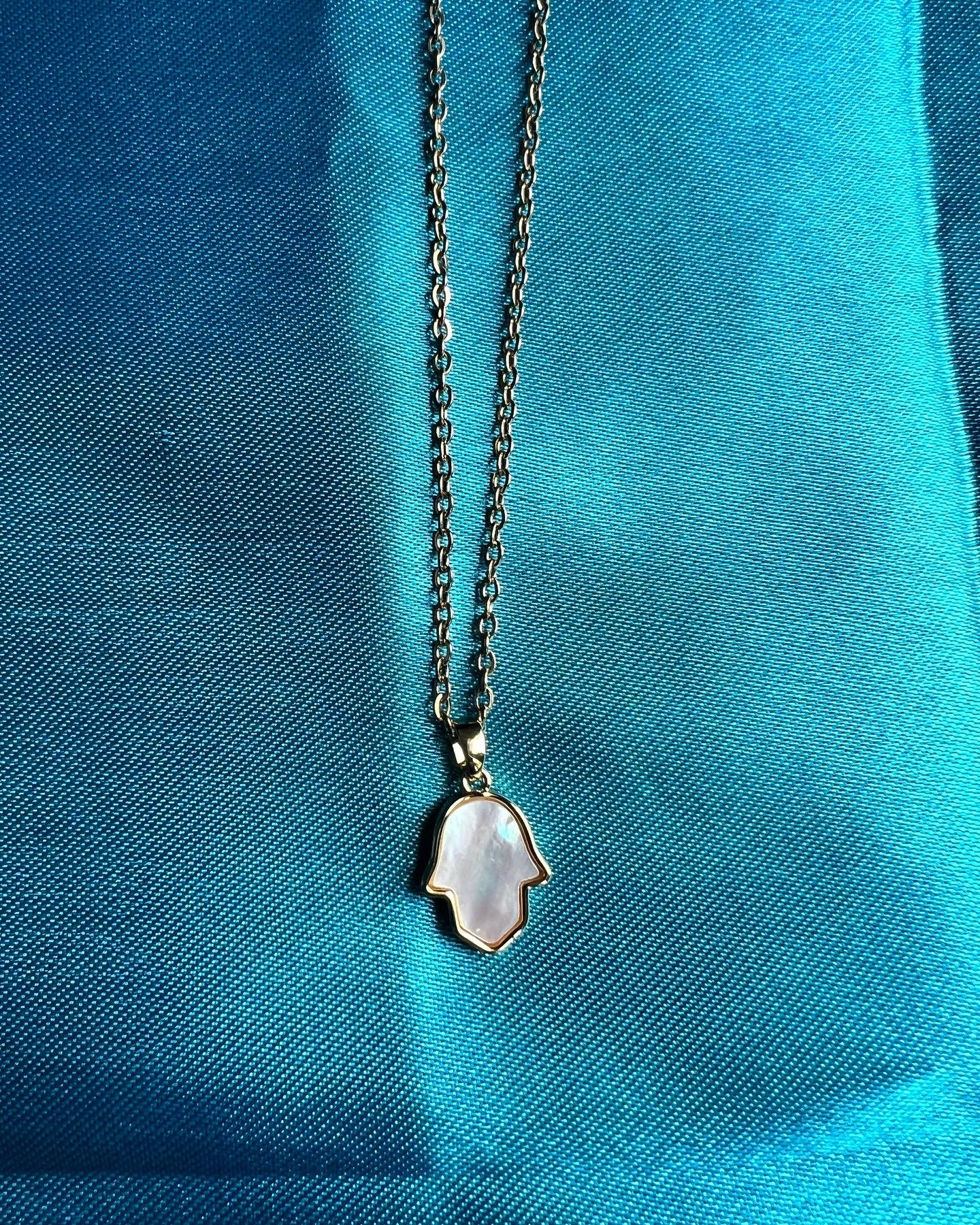 Pearl hamsa hand necklace