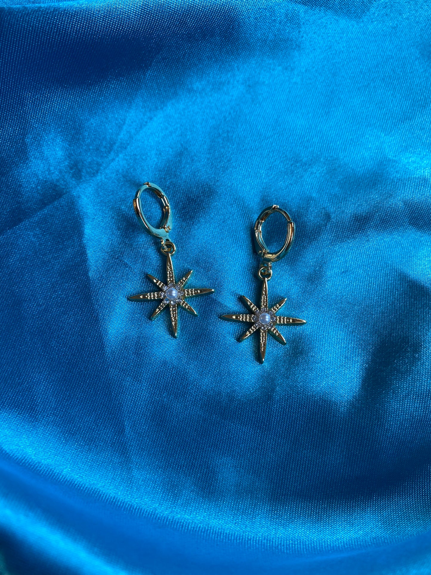 Star, heart, and angel earrings